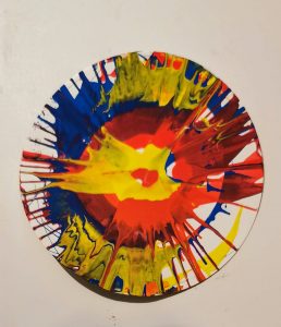 A completed spin art creation, courtesy of mama and son
