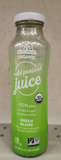 An open bottle of Nature's Nectar Green Blend Cold Pressed Juice, from Aldi