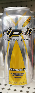 A can of Rip It Citrus X Sugar Free Energy Fuel sitting on a Dollar Tree shelf