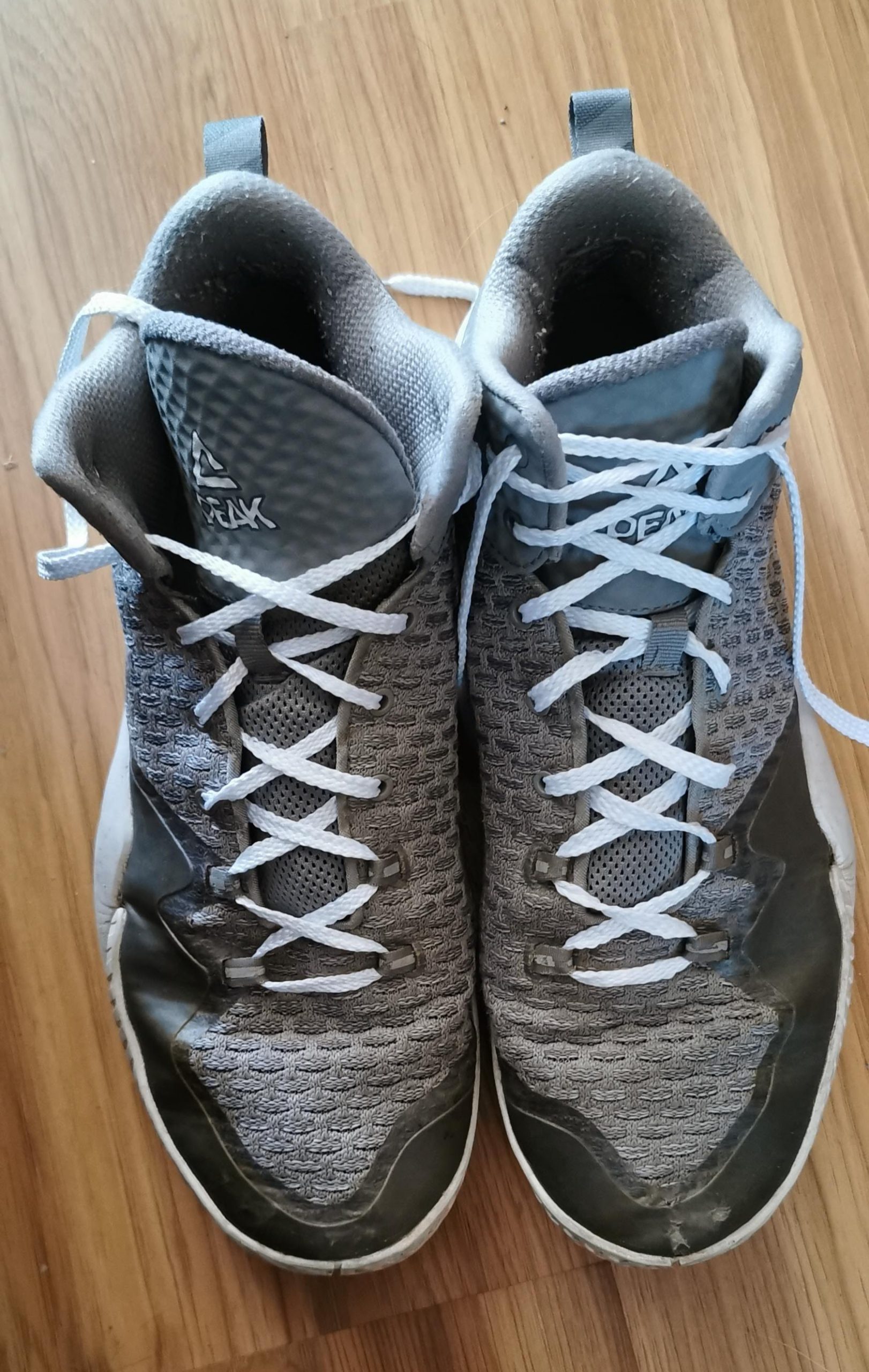 A pair of grey Peak Men's Basketball Shoes, as purchased from eBay.